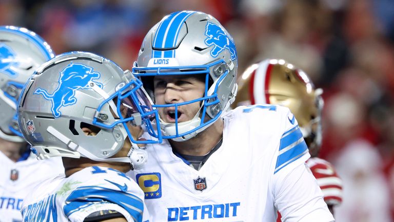 Detroit Lions quarterback Jared Goff (16) celebrates after throwing a touchdown pass to wide receiver Amon-Ra St. Brown (14) during the second half of an NFL football game against the San Francisco 49ers, Monday, Dec. 30, 2024, in Santa Clara, Calif. (AP Photo/Jed Jacobsohn)