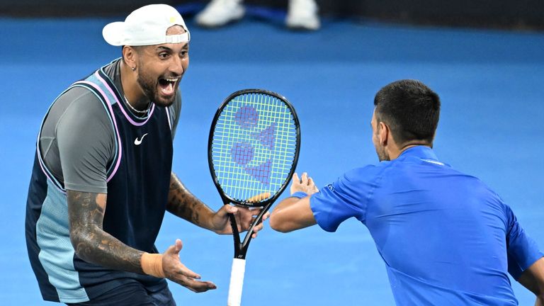 Australia's Nick Kyrgios, left, and Serbia's Novak Djokovic celebrate during their doubles match against Alexander Erler of Austria and Andreas Mies of Germany in the Brisbane International, at the Queensland Tennis Centre in Brisbane, Australia, Monday, Dec. 30, 2024. (Darren England/AAP Image via AP)