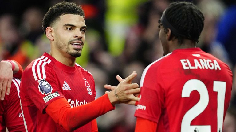 Morgan Gibbs-White celebrates with Anthony Elanga after scoring Nottingham Forest's second goal at Everton